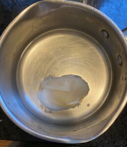 Bacon fat melting in pot-Image